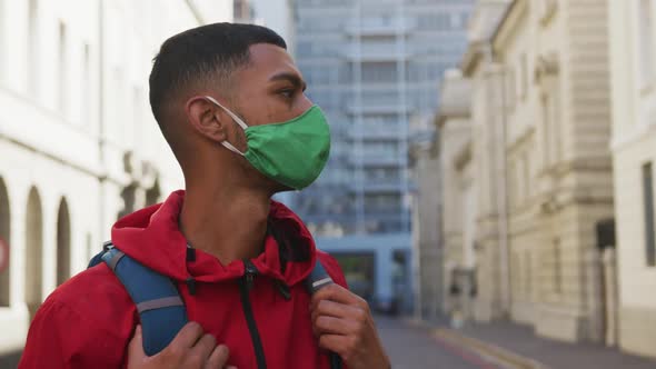 Mixed race man wearing face mask in the street