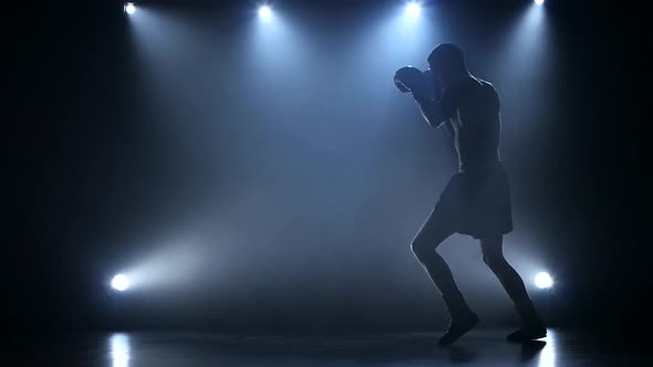 Male Sportsman Posing in the Studio with Lights, Slow Motion