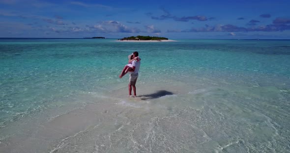 Happy man and woman married on vacation enjoy luxury on beach on paradise white sand background 4K