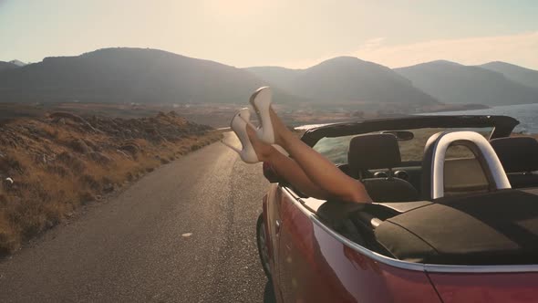 Sexy Legs From the Window of a Cabriolet Car