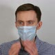 Young Man Coughs in a Medical Mask - VideoHive Item for Sale