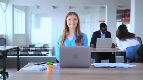 Friendly Manager Shows Greeting Viewers in Open Space Office Worker in Start Up Company