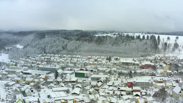 Winter is coming over a town in a little valley called Albstadt at the Swabian Alb, Germany. Flying