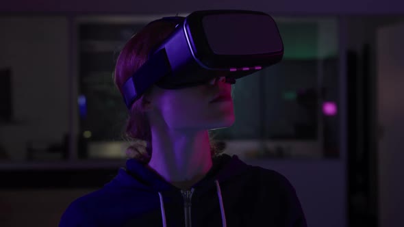 Caucasian woman wearing VR headset in creative office