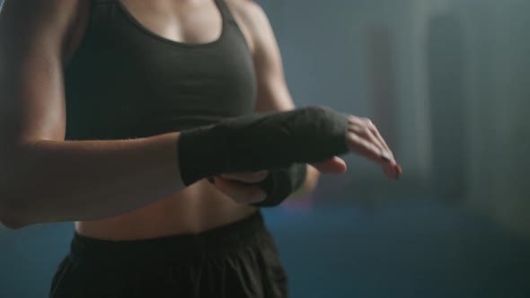 Woman Fighter Wraps Her Hands with Boxing Bandages Kickboxing Training Day in a Gym Female Fighter