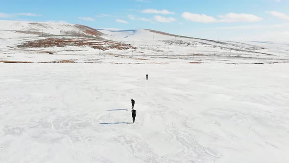 Person Films Aerial Footage Of Family Enjoying Winter 