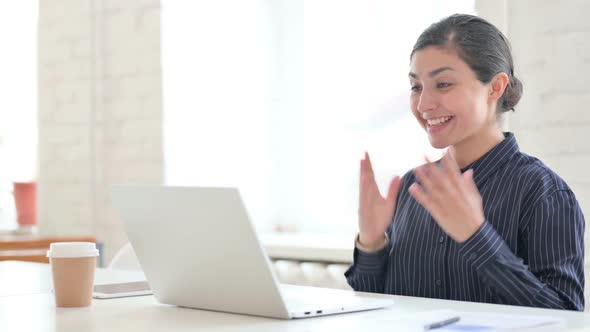 Young Indian Woman Doing Video Chat on Laptop