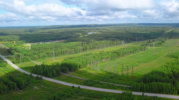 Top View of Summer Landscape of Green Forests and Meadows with Roads