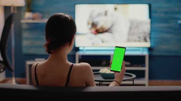 Caucasian Woman Holding Mobile Phone with Green Screen