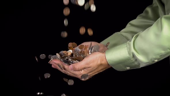 Hands Catching Falling Coins