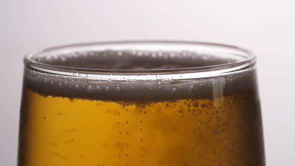 Beer Is Poured In A Glass