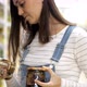 Young woman is chooses canned mushrooms in glass jar at supermarket. - VideoHive Item for Sale
