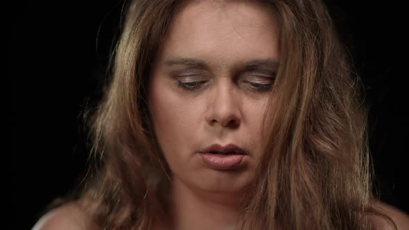 Headshot Portrait Depressed Overwhelmed Overweight Woman Chewing Measuring Tape Looking at Camera