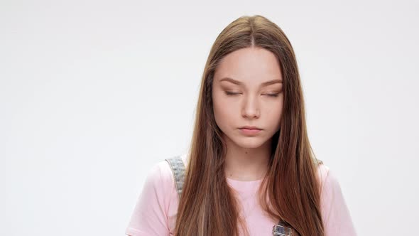 Sad Young Beautiful Girl Over White Background