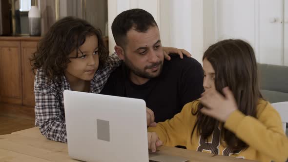 Single Father Studying with Kids Using Laptop / Videohive