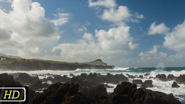 Storm Waves Breaking on Volcanic Stones