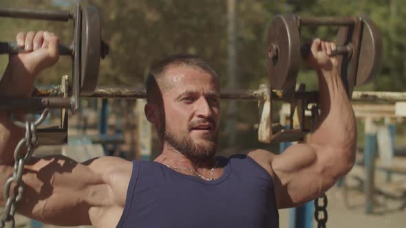 Fit Man Doing Exercise for Chest with Dumbbells