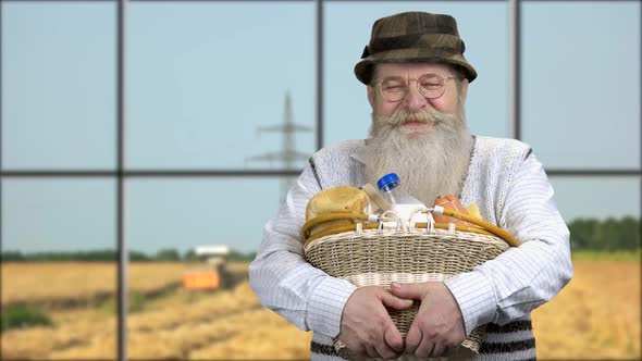 Happy Senior Farmer Holding Basket Wit Healthy Food