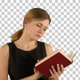 Young beautiful girl reading a book on laptop, Alpha Channel - VideoHive Item for Sale