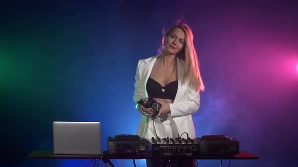 Beautiful Dj Girl in White Jacket, Headphones Playing Music and Dancing, Smoke, Flipping Hair, Slow