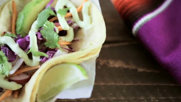 Street fish tacos with cod in recycled paper food tray.