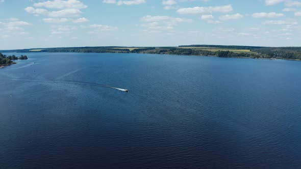 Panoramic view of a wide blue river among nature