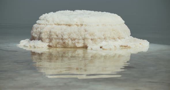 Tracking shot of salt deposits on the banks of the Dead Sea in israel