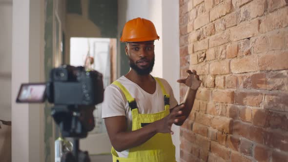 African Constructor Blogger Recording Video on Camera for Video Blog