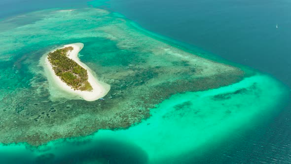 Travel Concept with a Sandy Beach and Blue Sea. Balabac, Palawan, Philippines