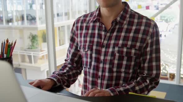 Young man working in a creative office