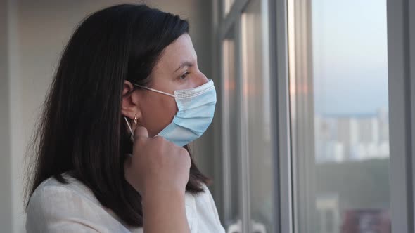 Nurse Woman Removes Virus Mask From Her Face And Breathes Fresh Air