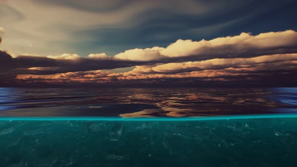 Split View Over and Under Water in the Caribbean Sea with Clouds