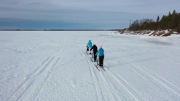 Following Kicksleds On The Ice With A Drone