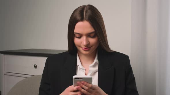 Portrait of Smiling Attractive Young Woman Using Phone for Online Shopping in Social Media Woman