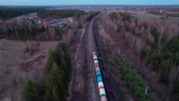 A Freight Trains Travel Towards the Village