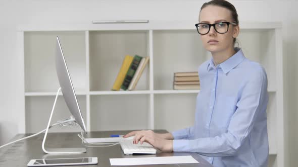 Young Casual Girl Shaking Head to Agree at Work