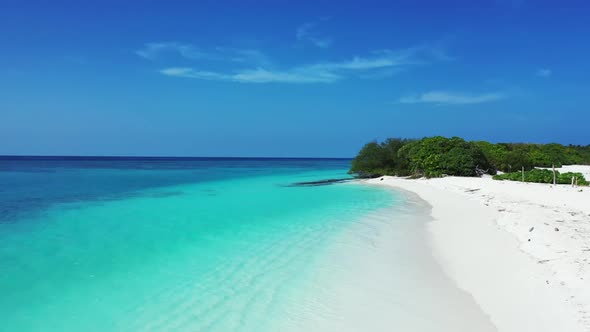 Aerial flying over texture of marine island beach holiday by blue water and white sand background of