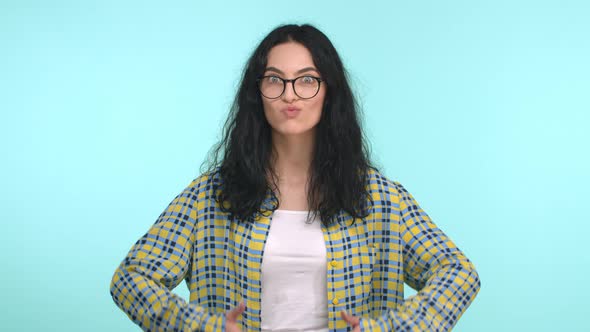 Charismatic Brunette Woman with Perfect White Smile Wearing Trendy Glasses Showing Thumbs Up and Nod