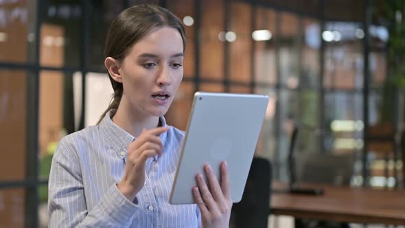 Young Woman Upset By Loss on Tablet