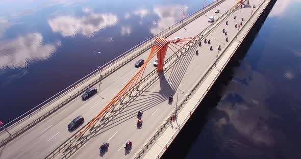 4K - Camera follows bikers on the bridge