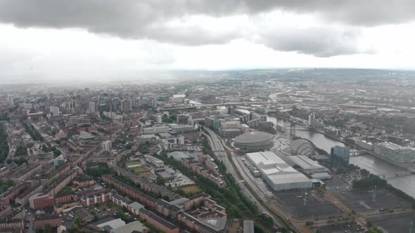 Descending drone shot over central Glasgow in the rain.