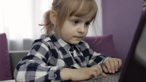 Girl Doing Lessons at Home Using Digital Laptop Computer. Distance Education