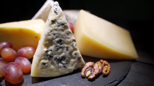 Cheese Plate Close-up with Several Varieties of Fruit and Honey Cheese