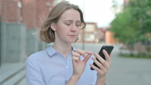 Portrait of Woman Using Smartphone Outdoor