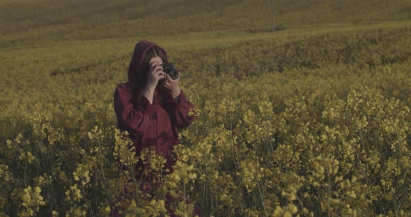 Happy Woman Walking Alone on Morning Flower Field Photographing Nature Sunrise Slow Motion. Young