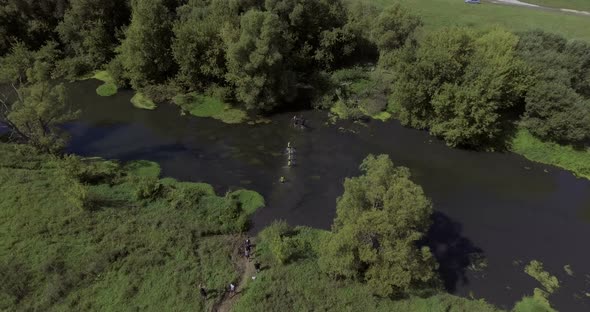 Runners in River in Endurance Race