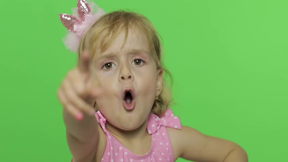 Positive Girl in Pink Swimsuit Emotionally Points at Something, Chroma Key