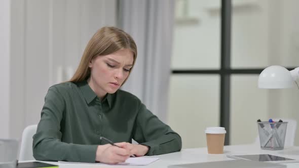 Young Woman Unable to Write on Paper Failure