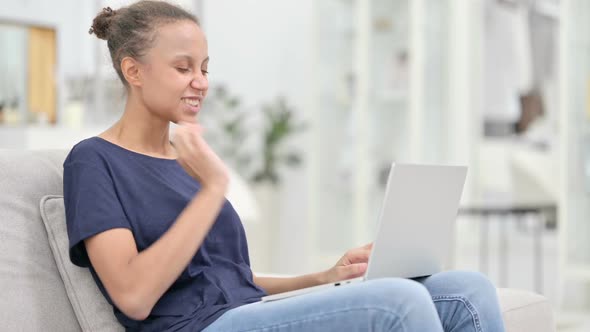 Tired African Woman with Laptop Having Neck Pain at Home