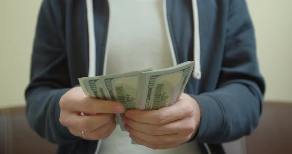 Man Counting Dollar Bills. Close Up of Male Hands Count Money Cash. Money Calculation. Employee